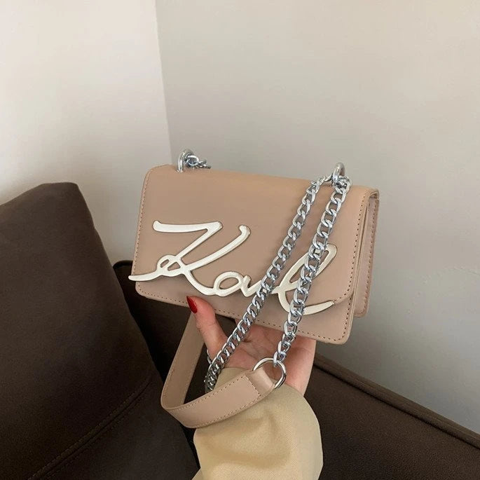 CaRaUaNa Karl Clutch Bag Khk in hand