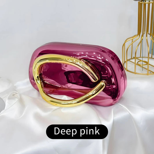 Deep pink Carauana Festival Clutch Bag with gold handle