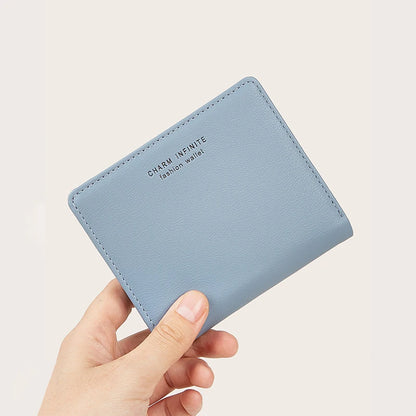 Light blue thin wallet held by a hand