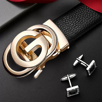 Gold belt buckle and silver cufflinks on a black surface
