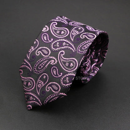 Purple paisley patterned tie on a dark gray background